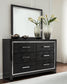 Kaydell Queen Upholstered Panel Headboard with Mirrored Dresser, Chest and Nightstand